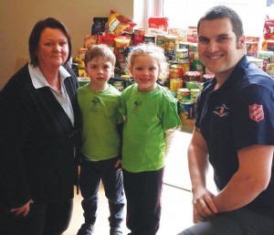 Centre Director Kym, children and Captain Nathan Hodges from The Salvation Army